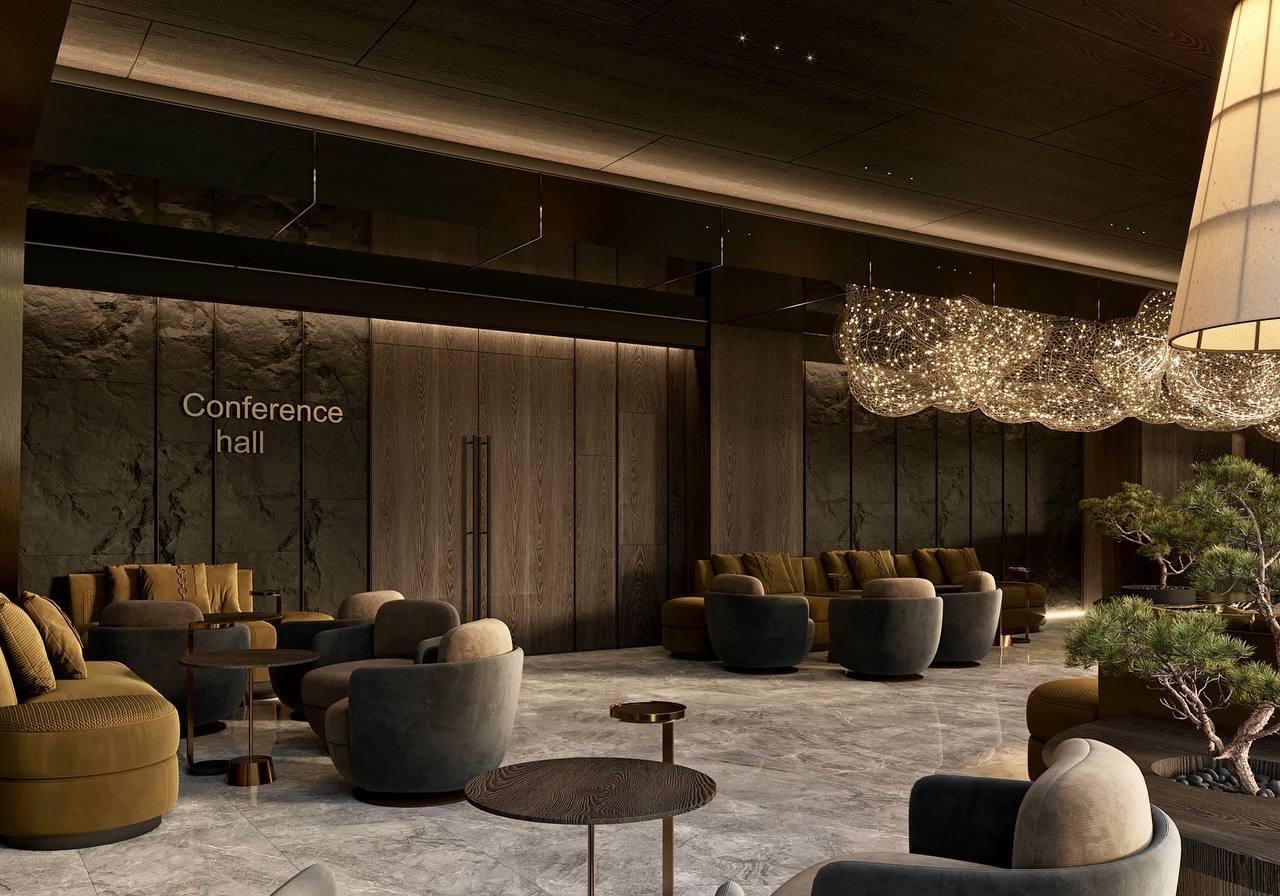 Conference hall lounge with stone walls and low seating